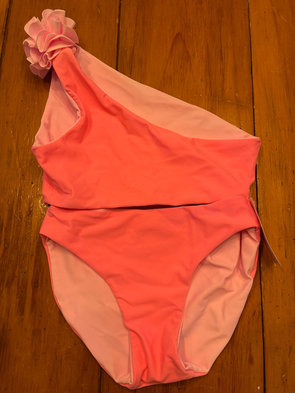 Snapper rock Girls' Neon Pink two Piece Swimsuit. With flower on shoulder UV50+